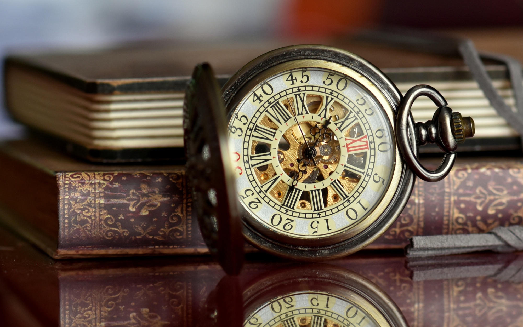 Very old pocket watch and books